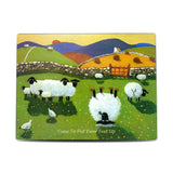 Cutting board with sheep resting in a field
