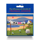 Refrigerator magnet showing a pair of sheep hanging from a clothes line