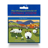 Refrigerator magnet showing sheep wearing reed shoes, lying upside down in a field