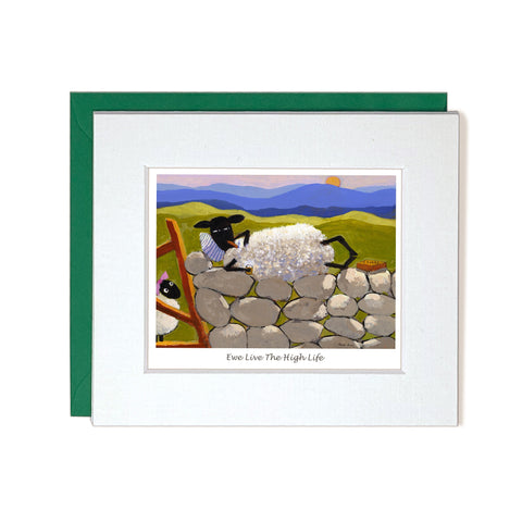 Card with mount sheep relaxing on wall drinking