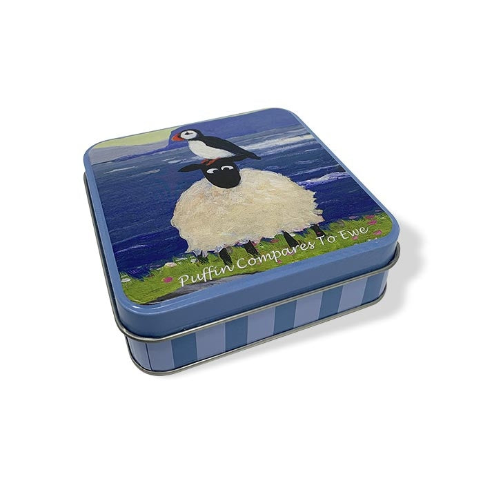 exquisite storage tin showcasing puffin and sheep artwork