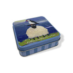 exquisite storage tin showcasing puffin and sheep artwork